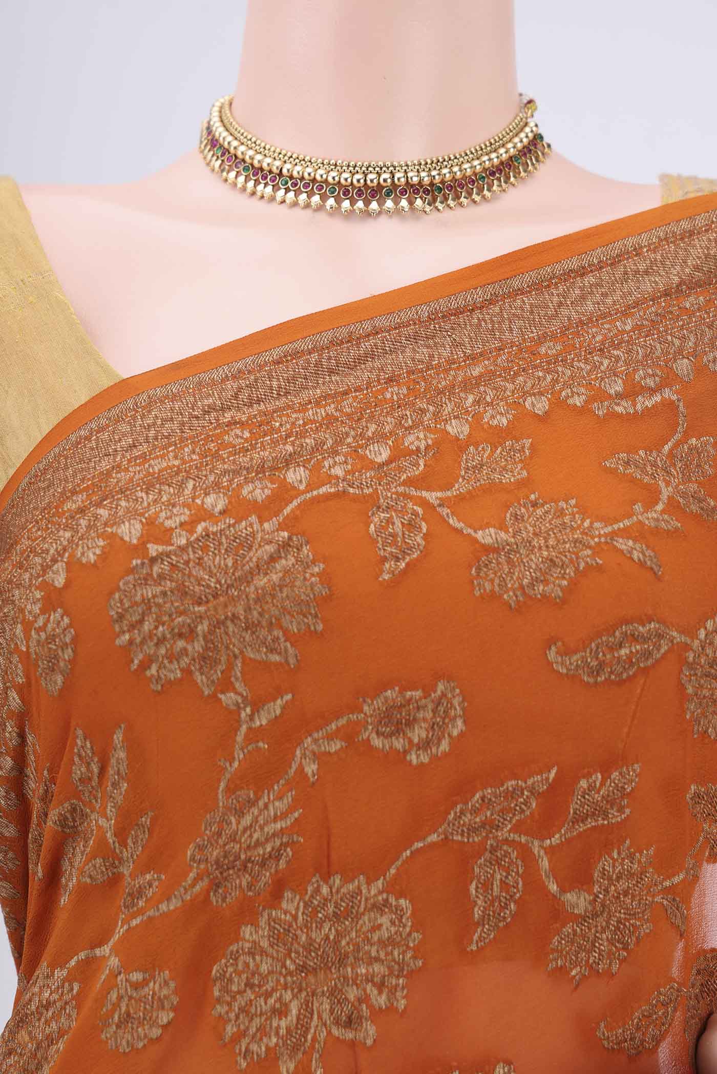 Border image of Rust Banarasi Georgette Saree with Zari Brocade on the body and Zari Border. 