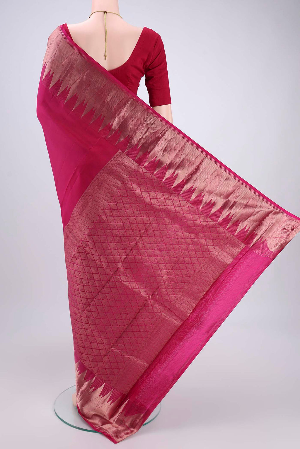 Flat view of Pink Kanchipuram Silk Saree with Zari Butta on the body and Zari Border. 