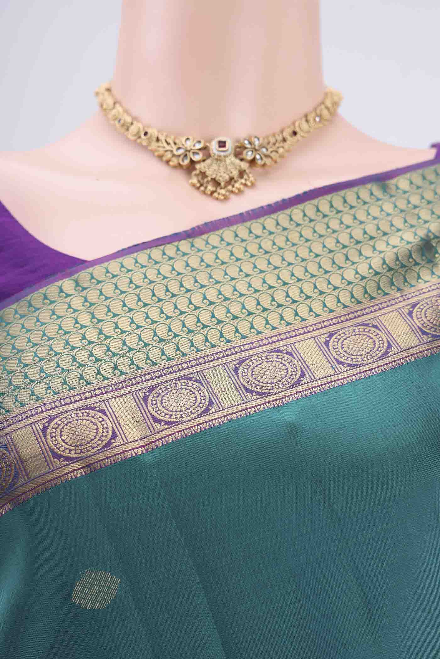 Border image of Turquoise Kanchipuram Silk Saree with Zari Butta on the body and Zari Border. 