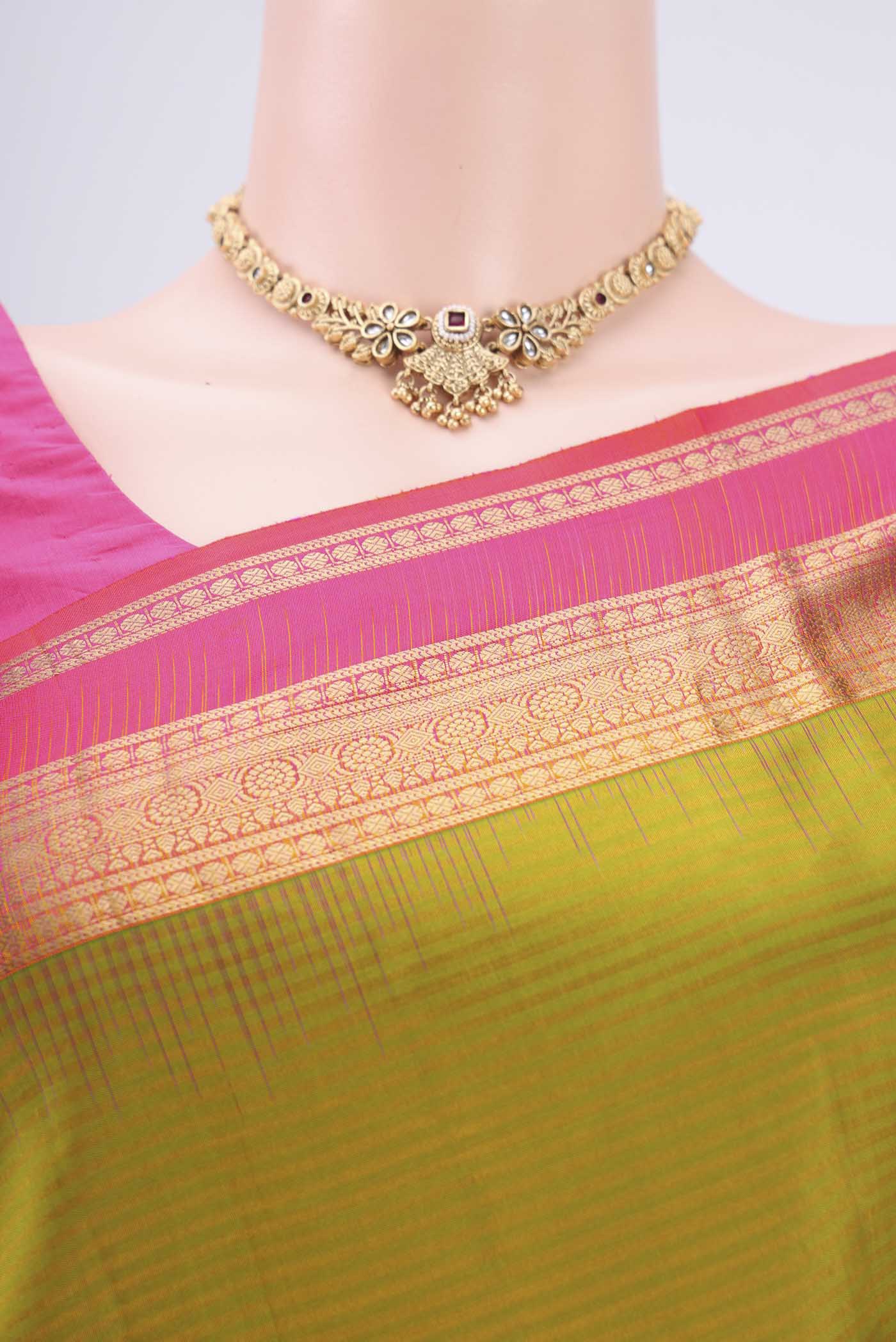 Border image of Green Kanchipuram Silk Saree with Zari Butta on the body and Zari Border. 
