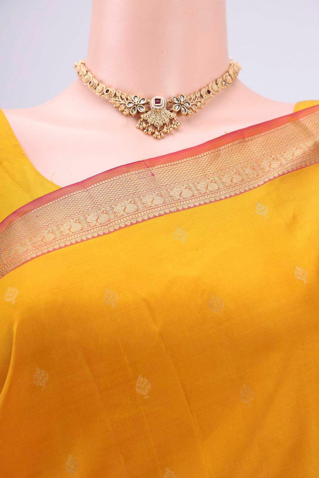Border image of Yellow Kanchipuram Silk Saree with Zari Butta on the body and Zari Border. 