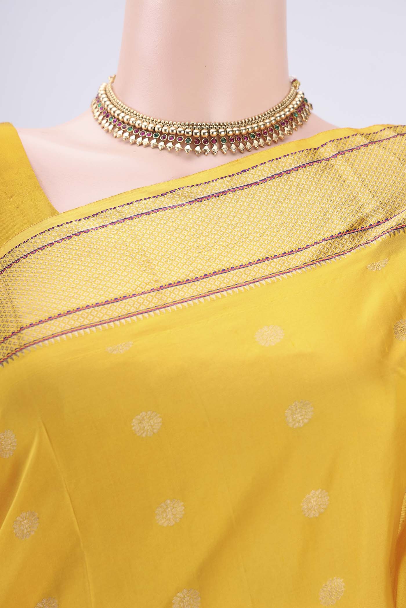 Border image of Yellow Blended Bangalore Silk Saree with Zari Butta on the body and Paithani Border. 