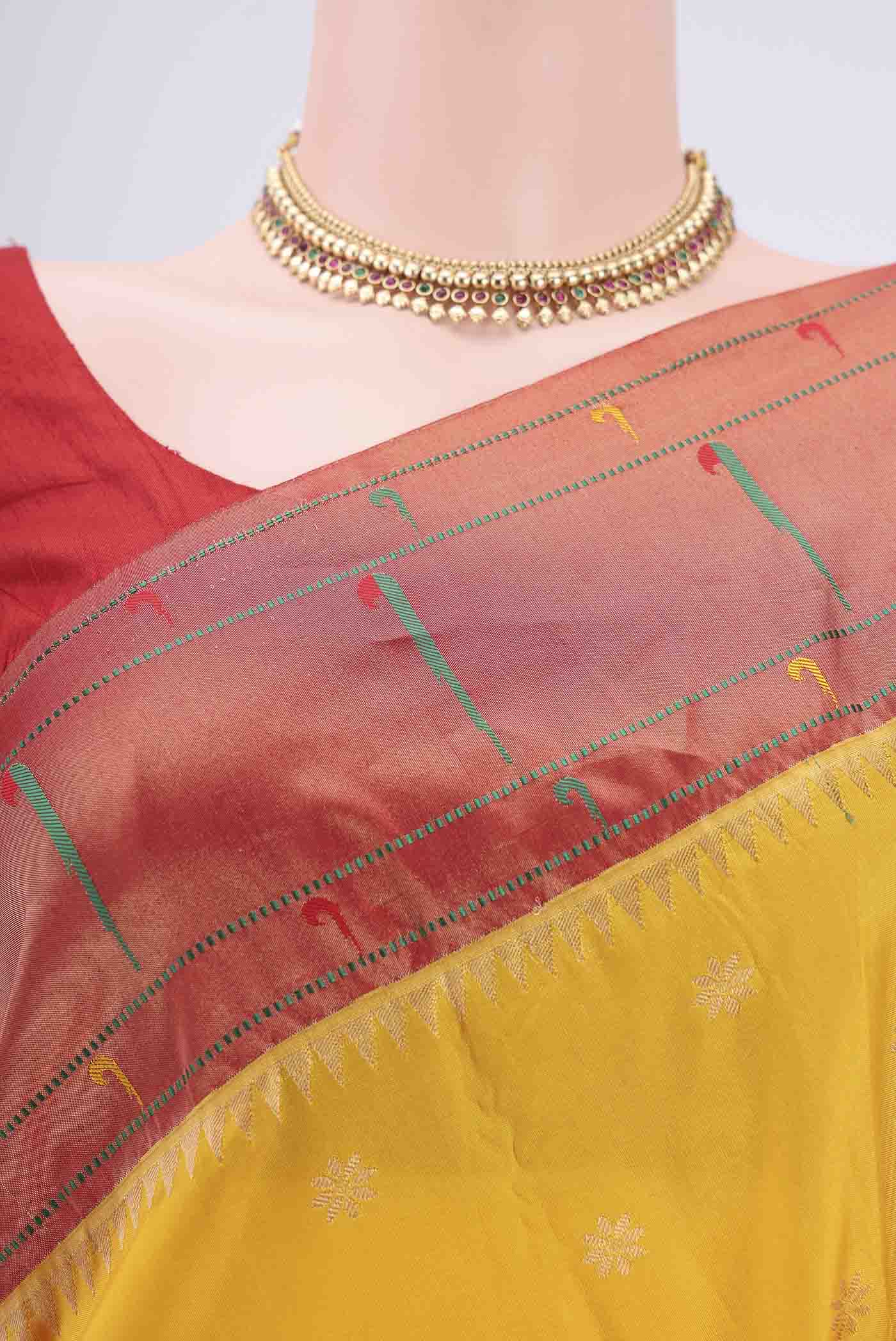 Border image of Yellow Blended Bangalore Silk Saree with Zari Butta on the body and Paithani Border. 