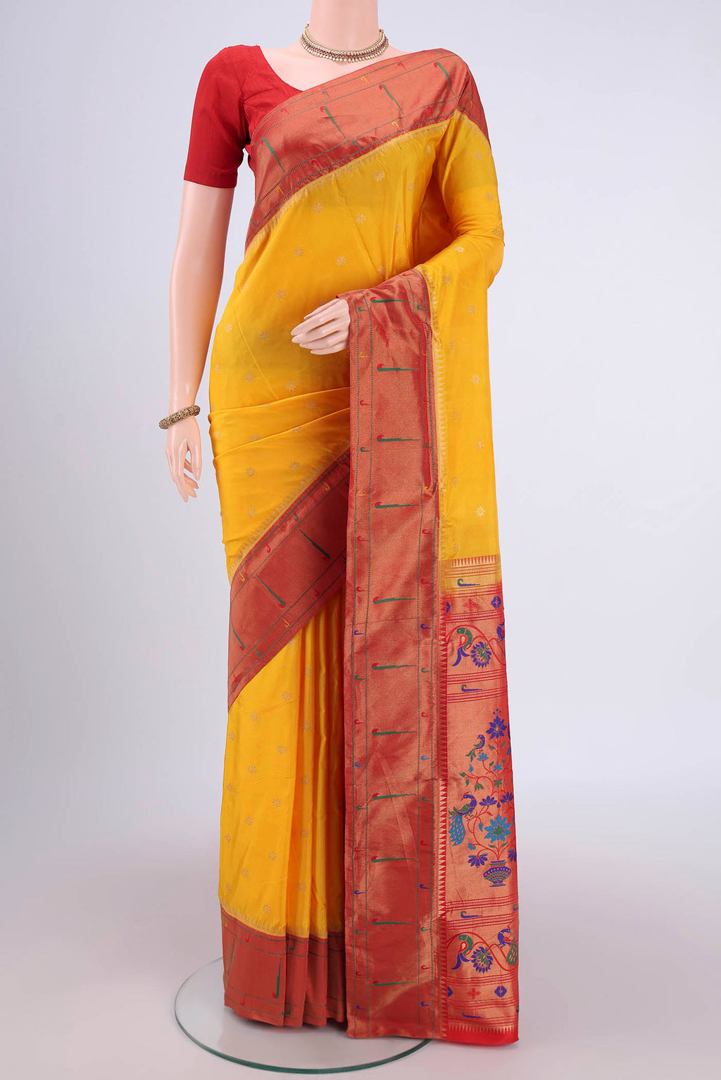 Yellow Blended Bangalore Silk Saree with Zari Butta on the body and Paithani Border.  displayed on a mannequin
