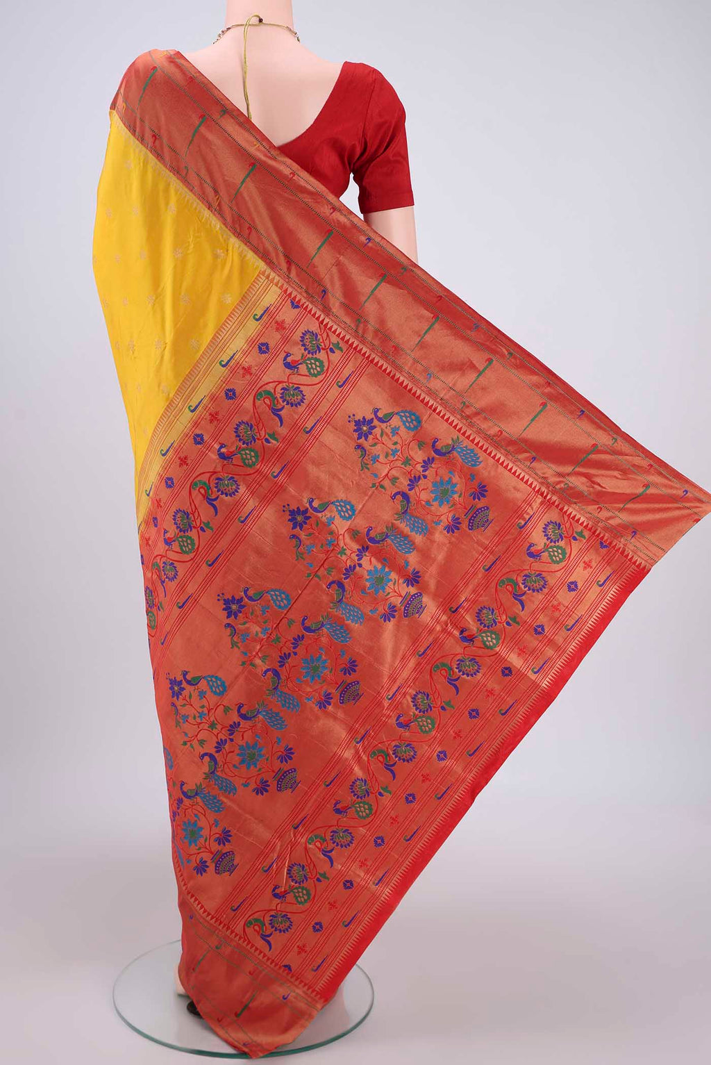 Flat view of Yellow Blended Bangalore Silk Saree with Zari Butta on the body and Paithani Border. 
