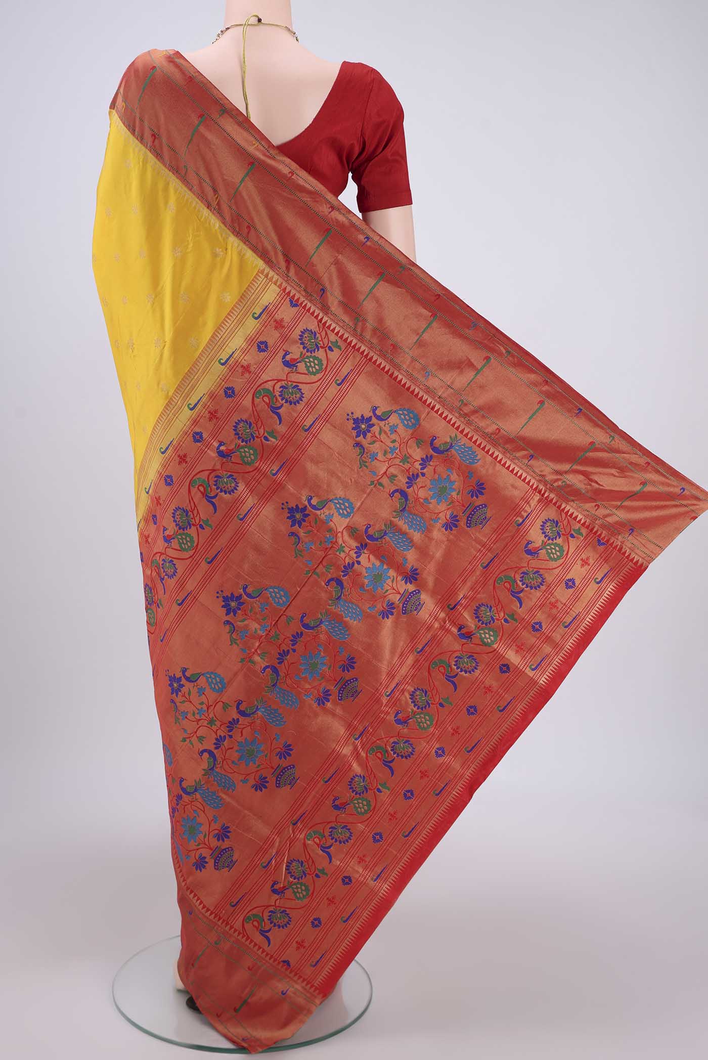 Flat view of Yellow Blended Bangalore Silk Saree with Zari Butta on the body and Paithani Border. 