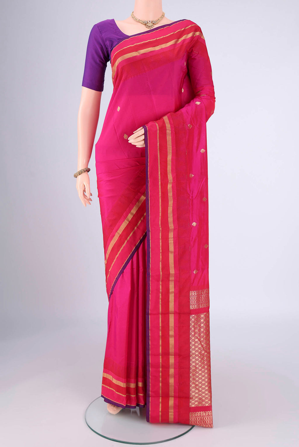 Rani Pink Blended Bangalore Silk Saree with Zari Butta on the body and Zari Border.  displayed on a mannequin