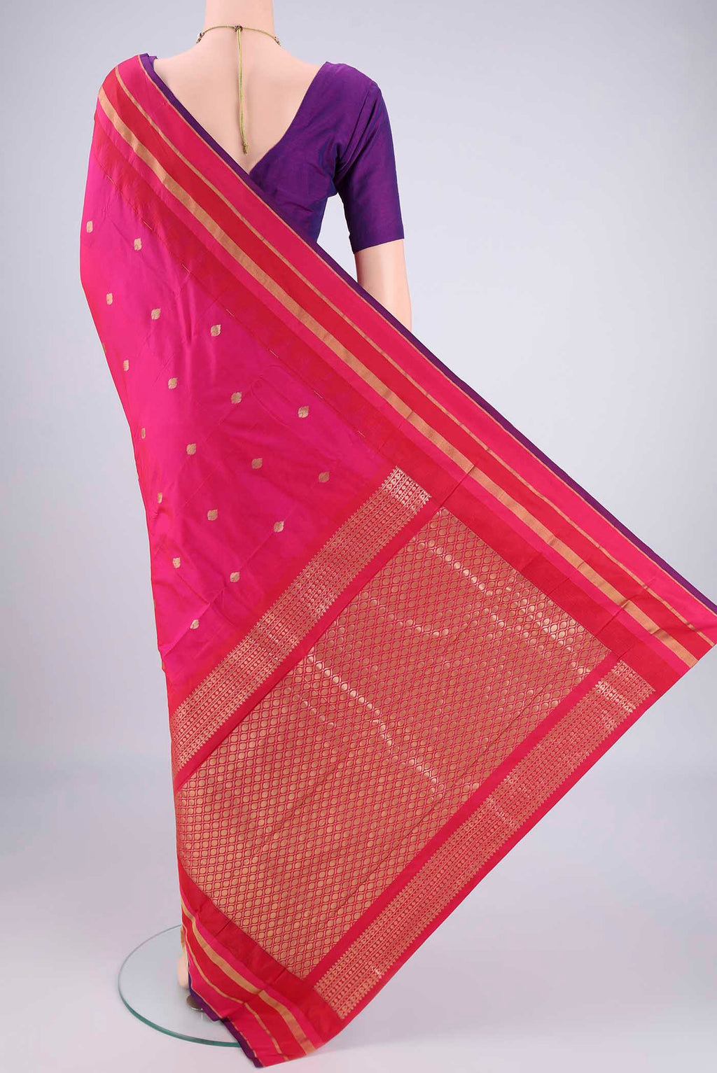 Flat view of Rani Pink Blended Bangalore Silk Saree with Zari Butta on the body and Zari Border. 