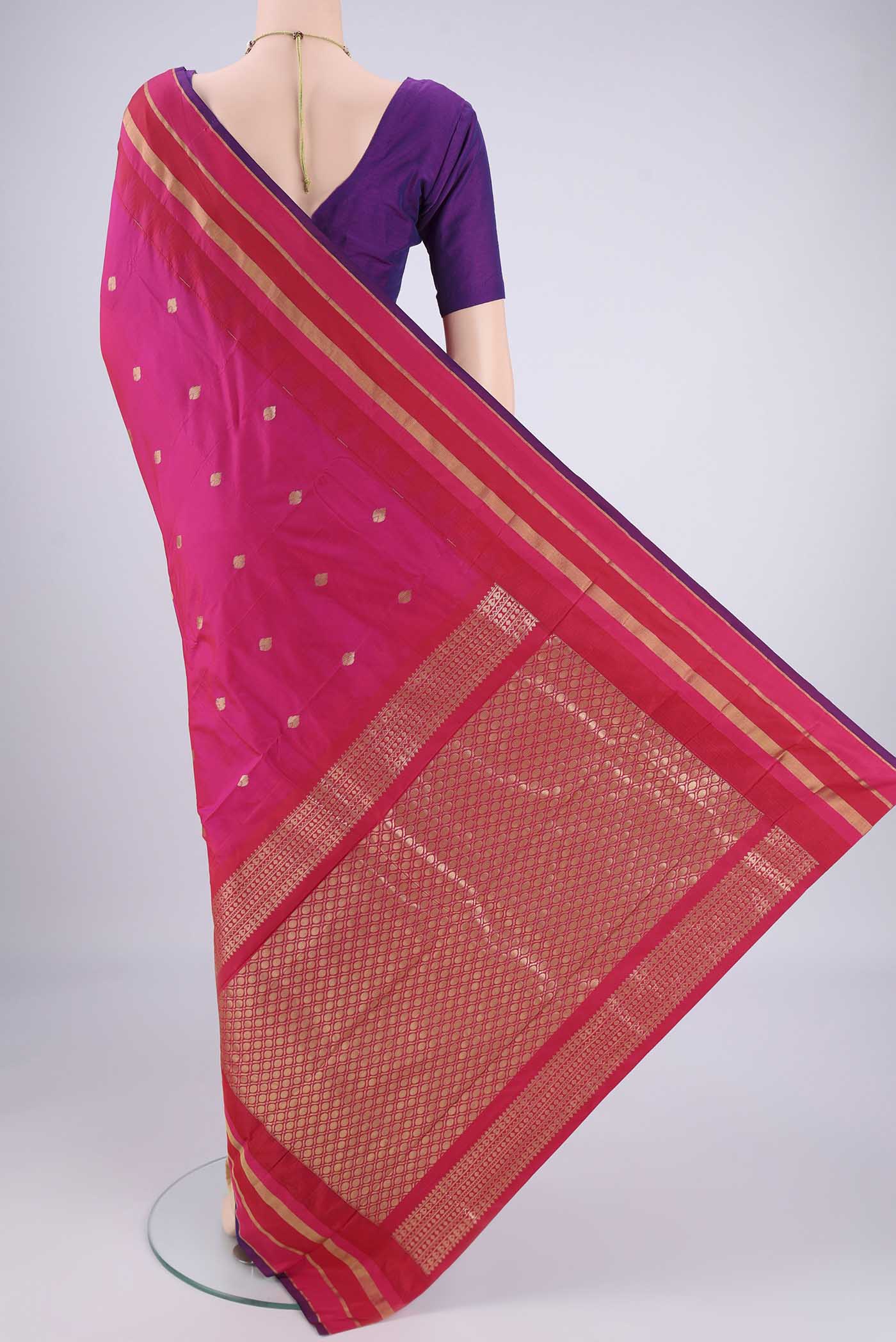 Flat view of Rani Pink Blended Bangalore Silk Saree with Zari Butta on the body and Zari Border. 