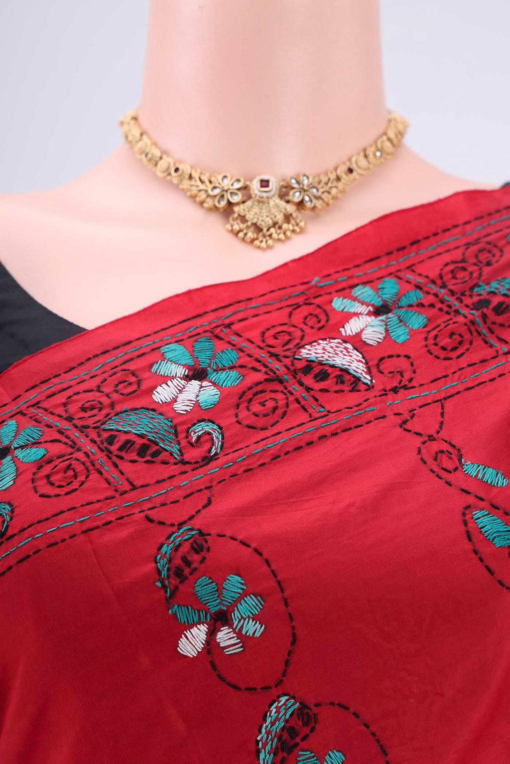 Border image of Red Tussar Silk Saree with Kantha Work on the body and Embroidery Border. 