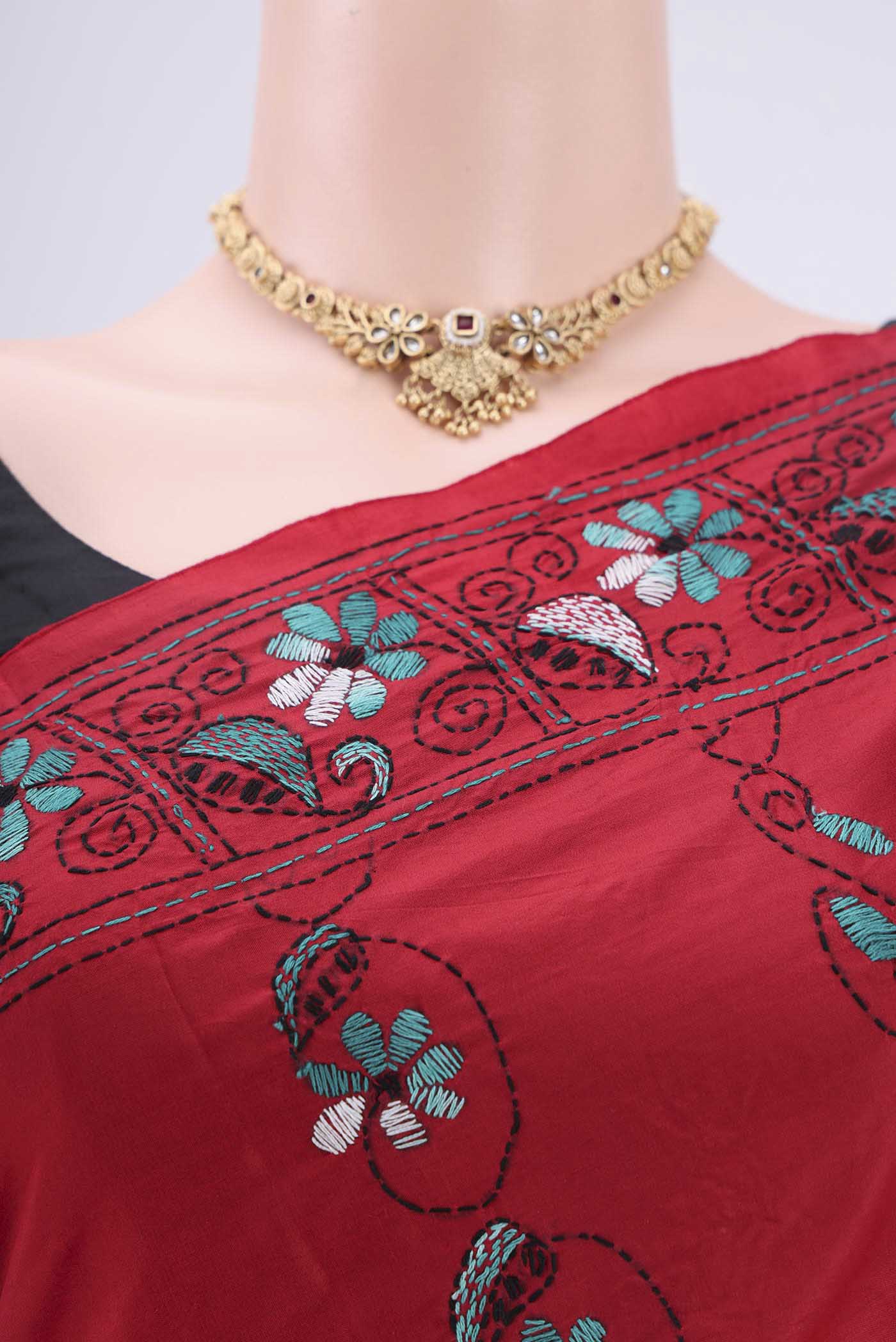 Border image of Red Tussar Silk Saree with Kantha Work on the body and Embroidery Border. 