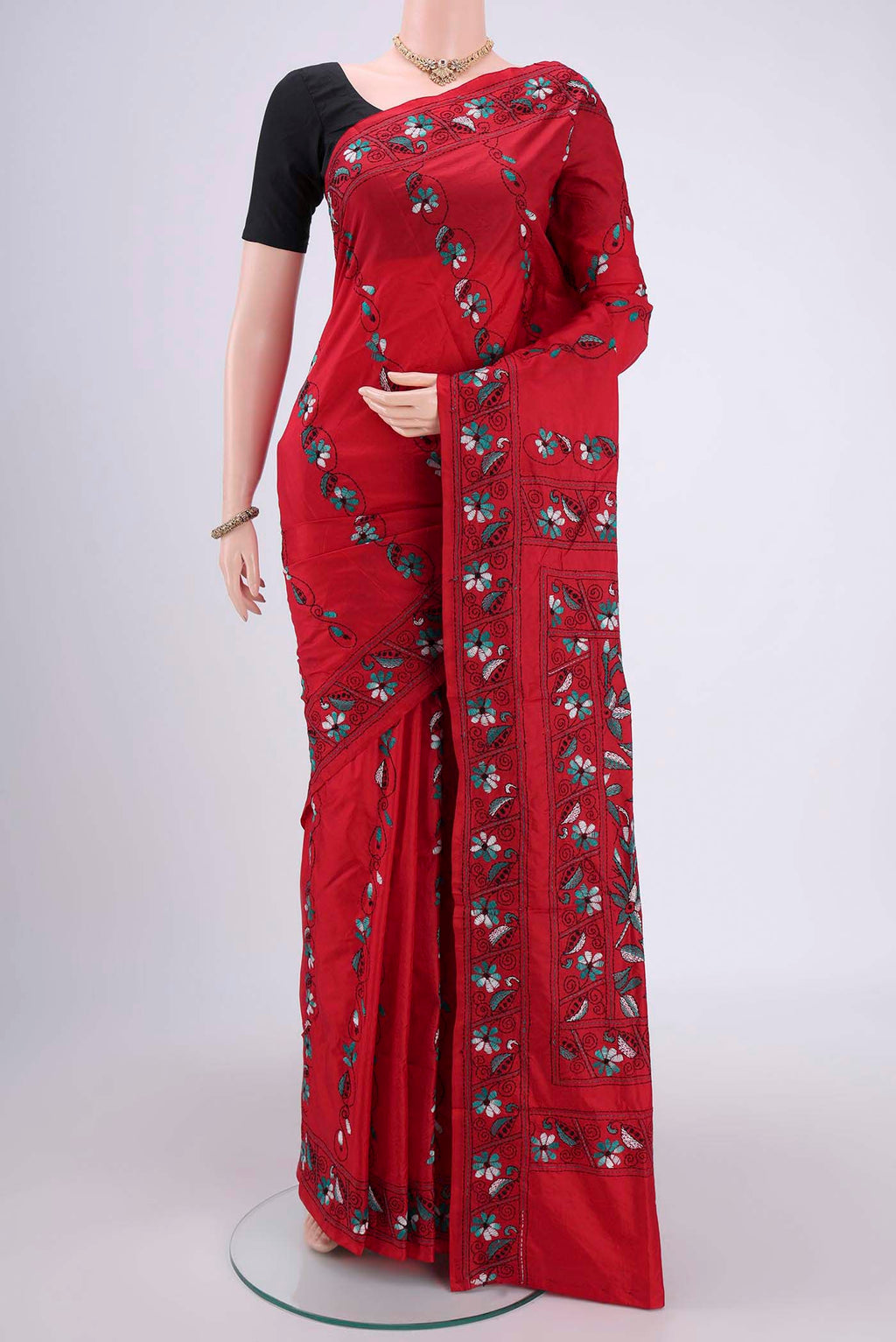 Red Tussar Silk Saree with Kantha Work on the body and Embroidery Border.  displayed on a mannequin