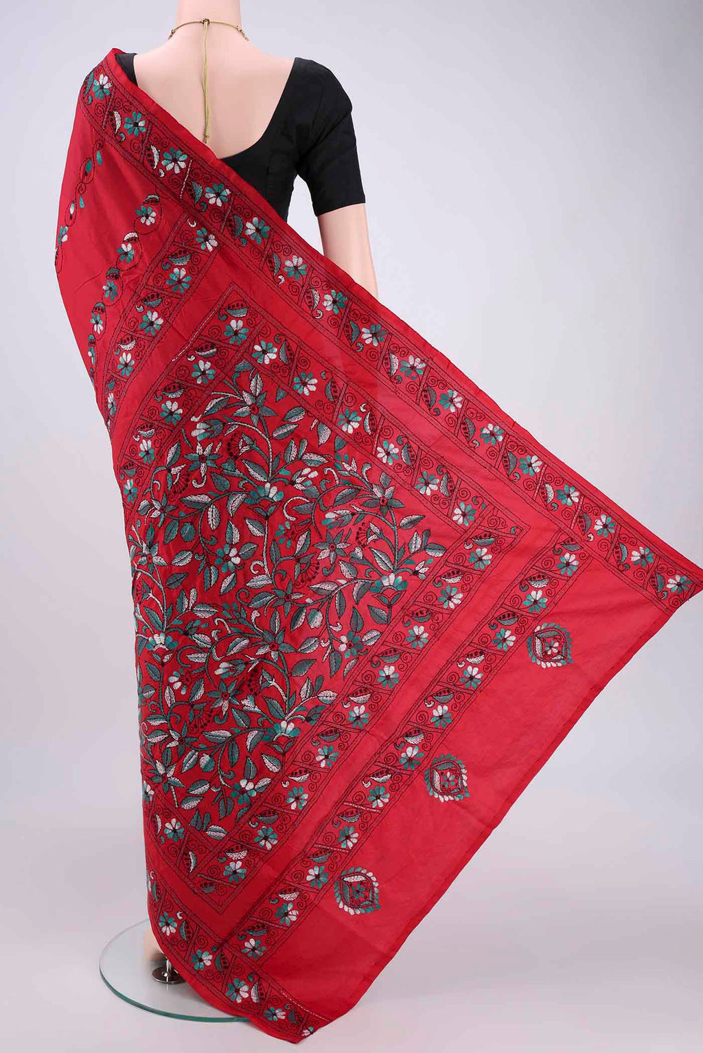 Flat view of Red Tussar Silk Saree with Kantha Work on the body and Embroidery Border. 