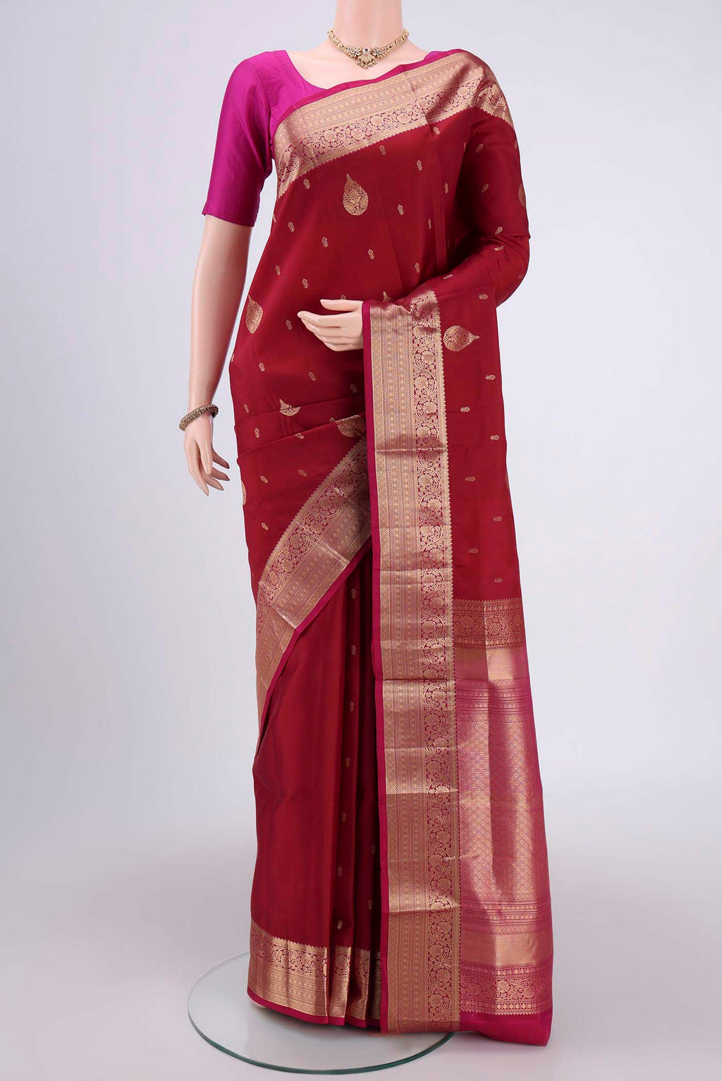 Maroon Dual Tone Soft Silk Saree with Zari Butta on the body and Zari Border.  displayed on a mannequin