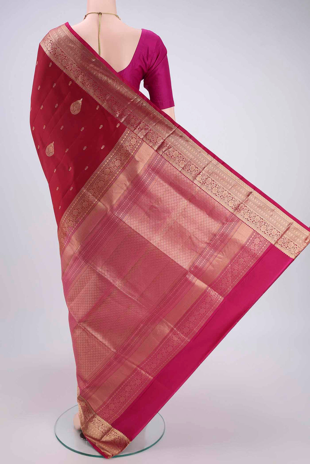 Flat view of Maroon Dual Tone Soft Silk Saree with Zari Butta on the body and Zari Border. 