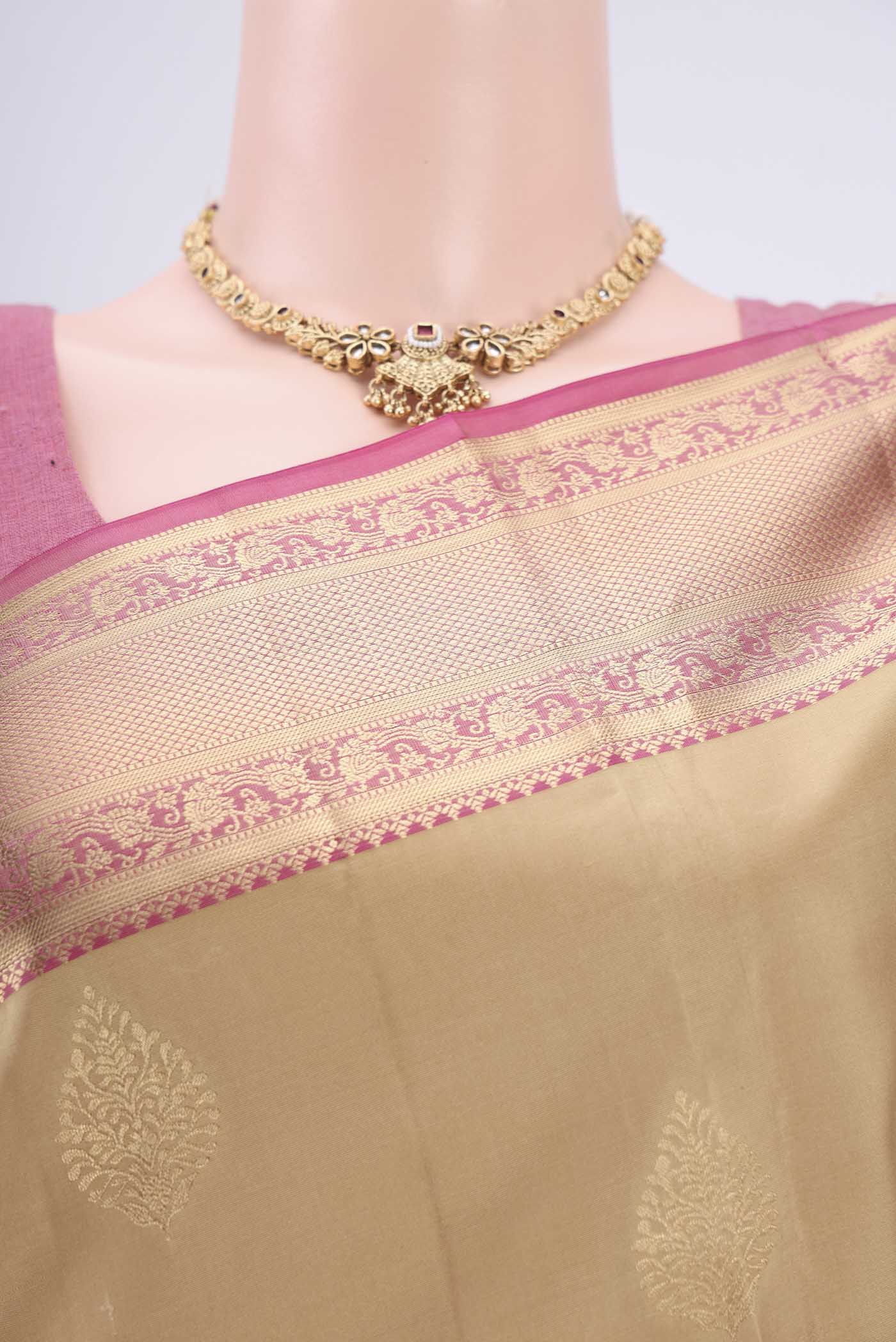 Border image of Beige Soft Silk Saree with Zari Butta on the body and Zari Border. 