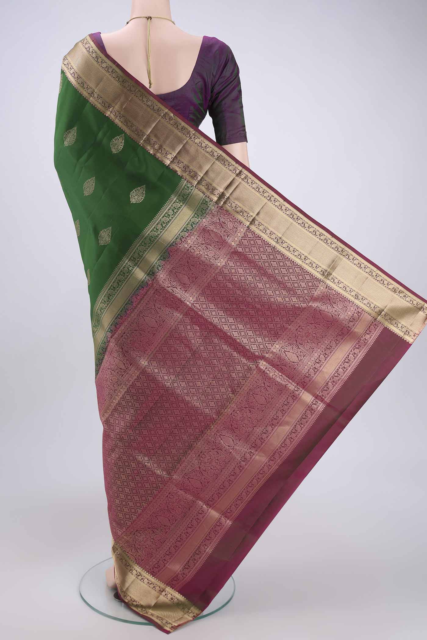 Flat view of Green Soft Silk Saree with Zari Butta on the body and Zari Border. 