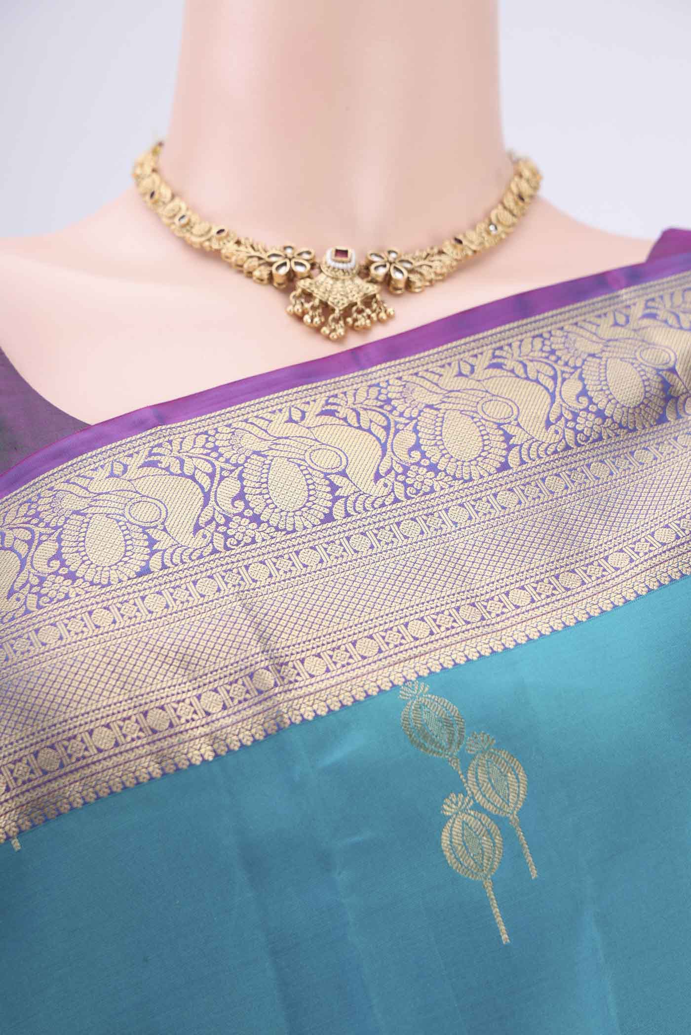 Border image of Blue Soft Silk Saree with Zari Butta on the body and Zari Border. 