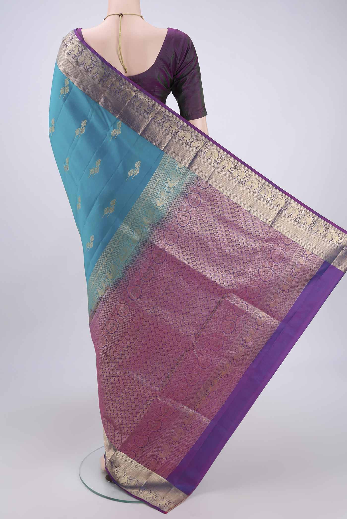Flat view of Blue Soft Silk Saree with Zari Butta on the body and Zari Border. 