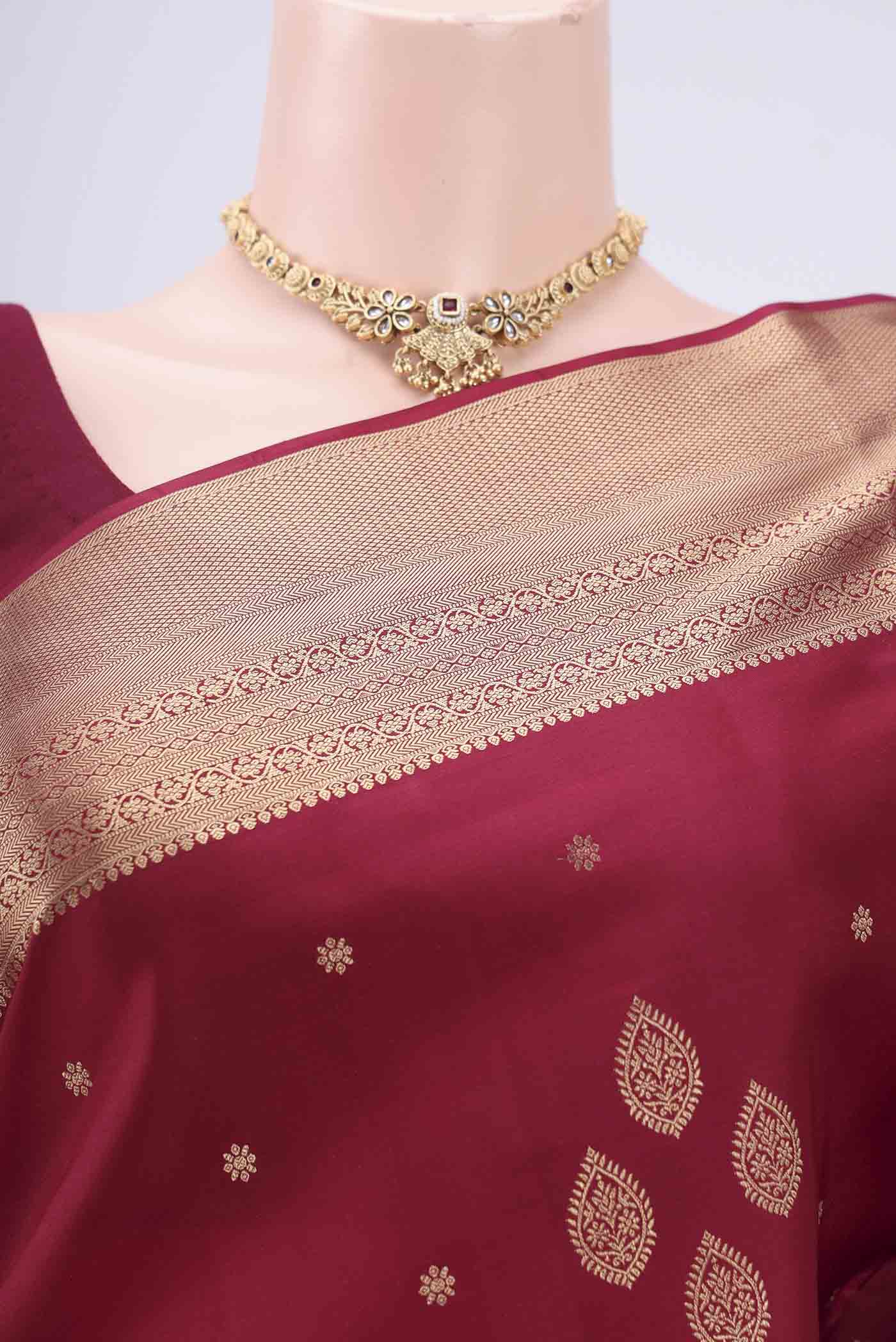 Border image of Maroon Dual Tone Soft Silk Saree with Zari Butta on the body and Zari Border. 