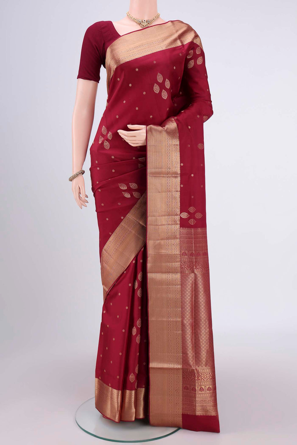 Maroon Dual Tone Soft Silk Saree with Zari Butta on the body and Zari Border.  displayed on a mannequin
