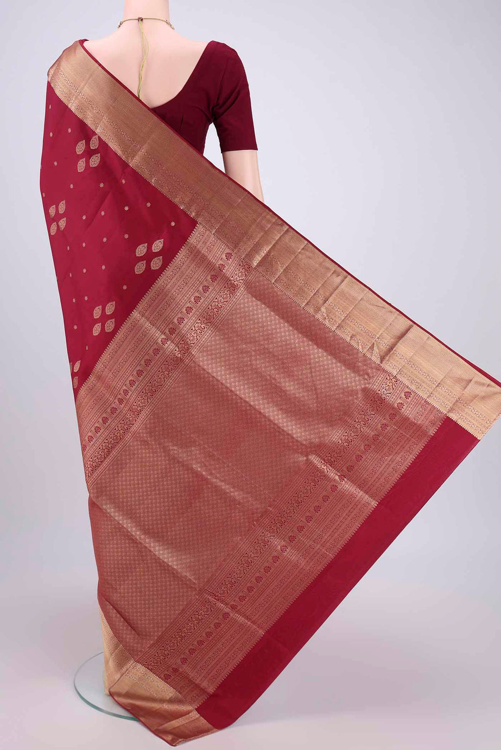 Flat view of Maroon Dual Tone Soft Silk Saree with Zari Butta on the body and Zari Border. 