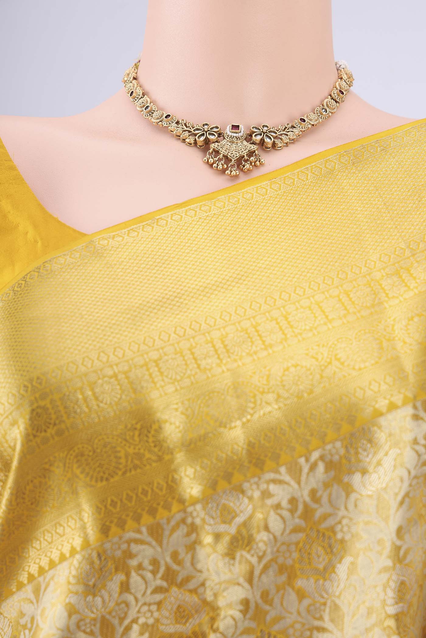 Border image of Lemon Yellow Dual Tone Kanjivaram Silk Saree with Zari Brocade on the body and Zari Border. 