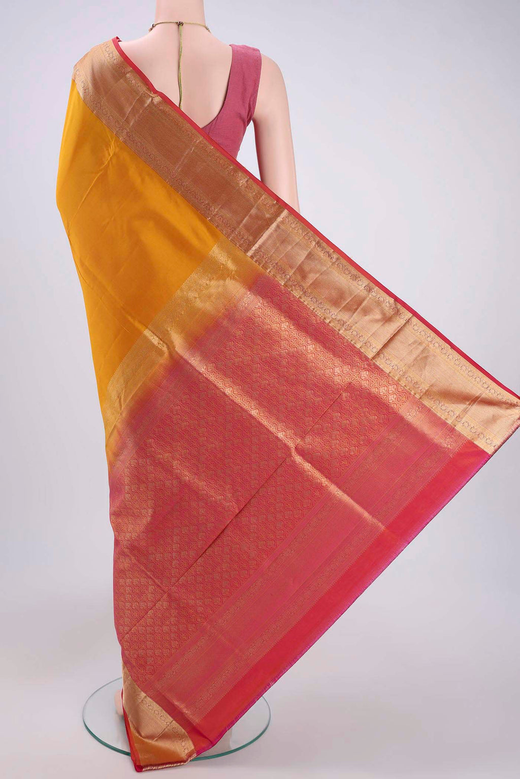 Flat view of Mustard Soft Silk Saree with Plain Body and Zari Border. 
