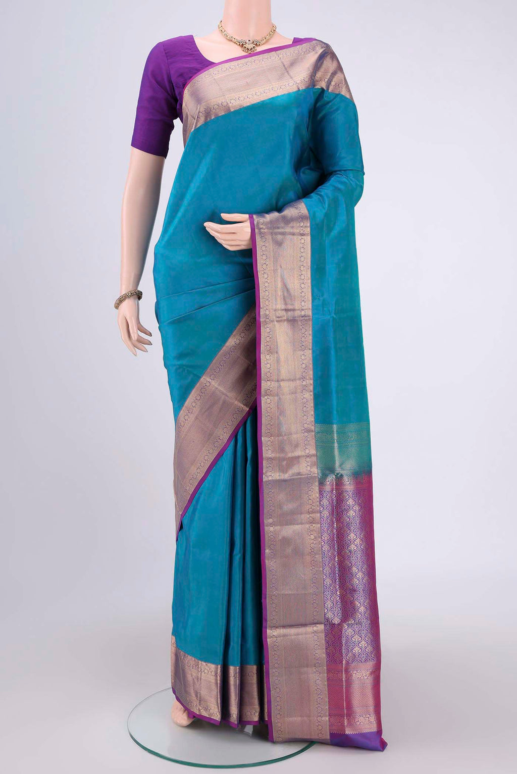 Blue Soft Silk Saree with Plain Body and Zari Border.  displayed on a mannequin