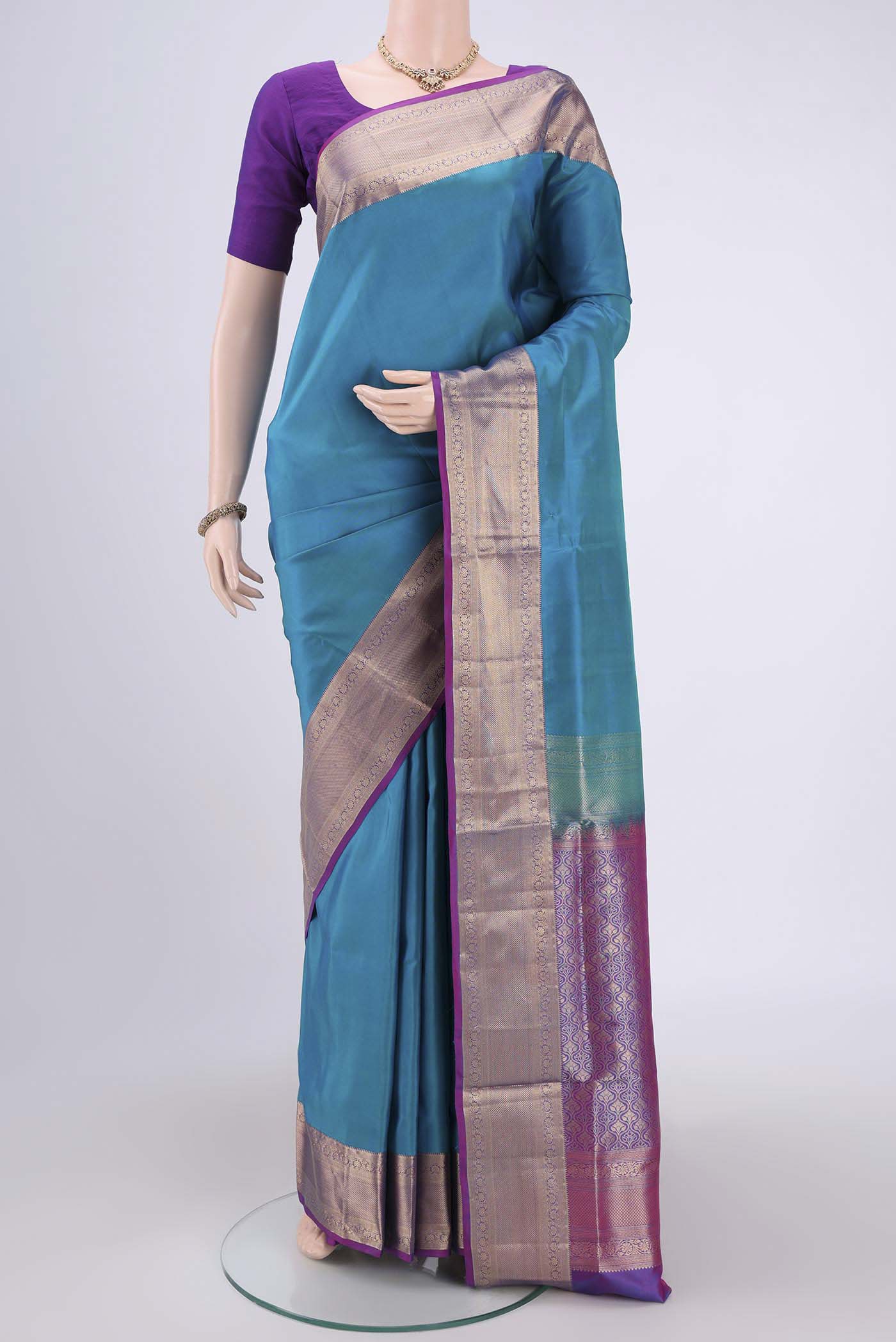 Blue Soft Silk Saree with Plain Body and Zari Border.  displayed on a mannequin