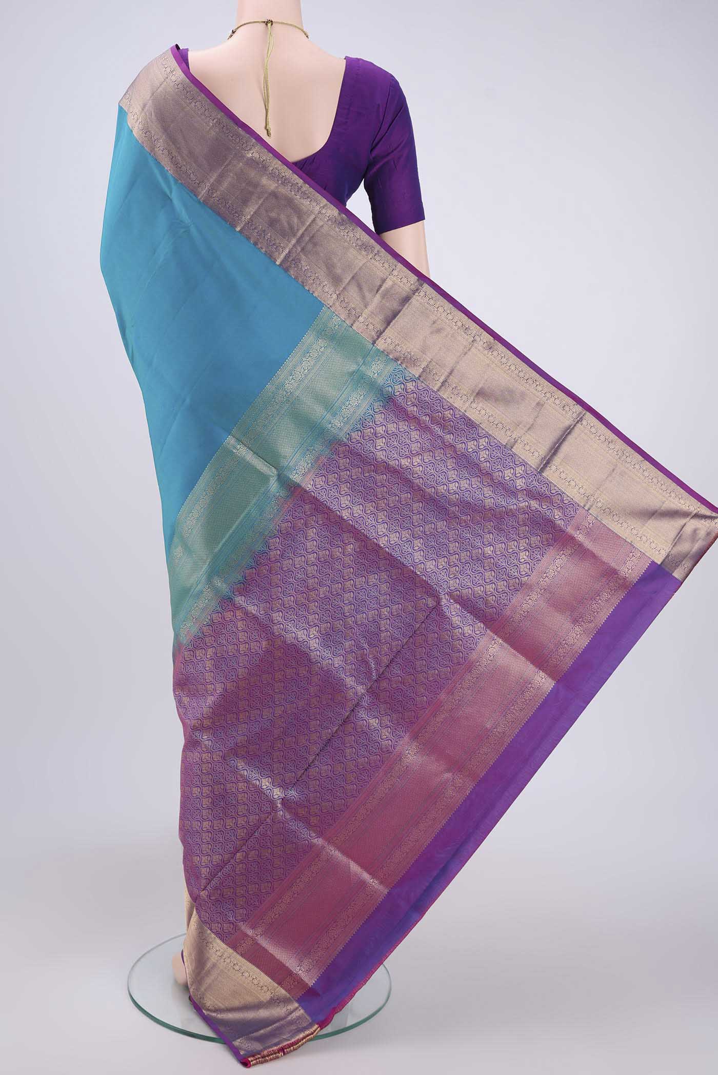 Flat view of Blue Soft Silk Saree with Plain Body and Zari Border. 
