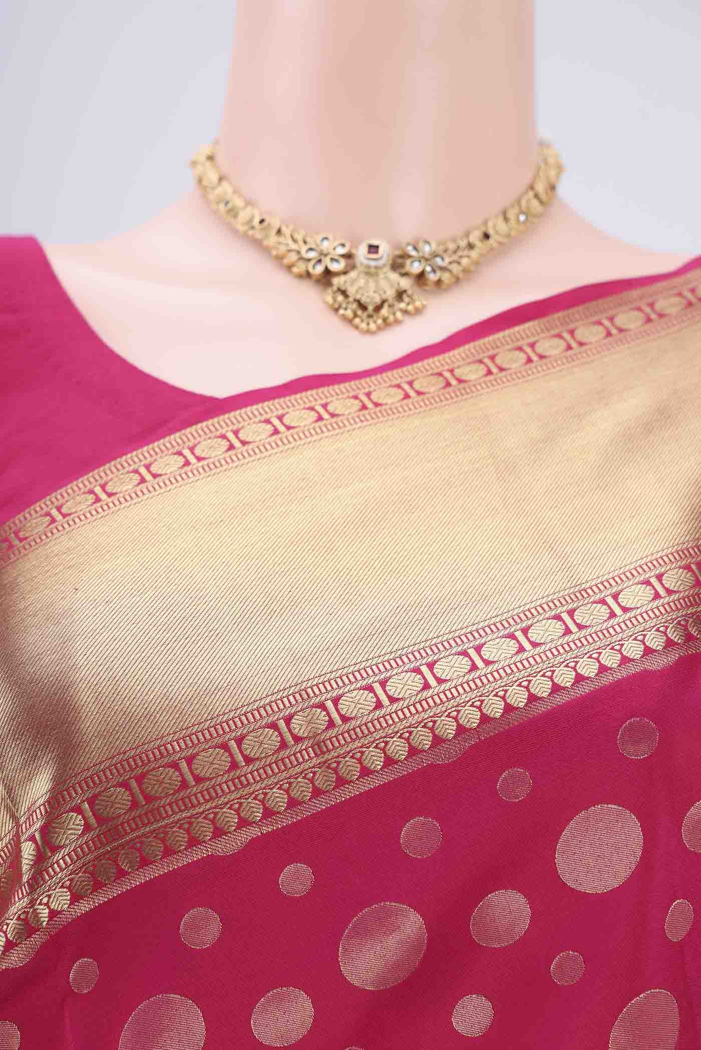 Border image of Rani Pink Soft Silk Saree with Polka Dots on the body and Zari Border. 