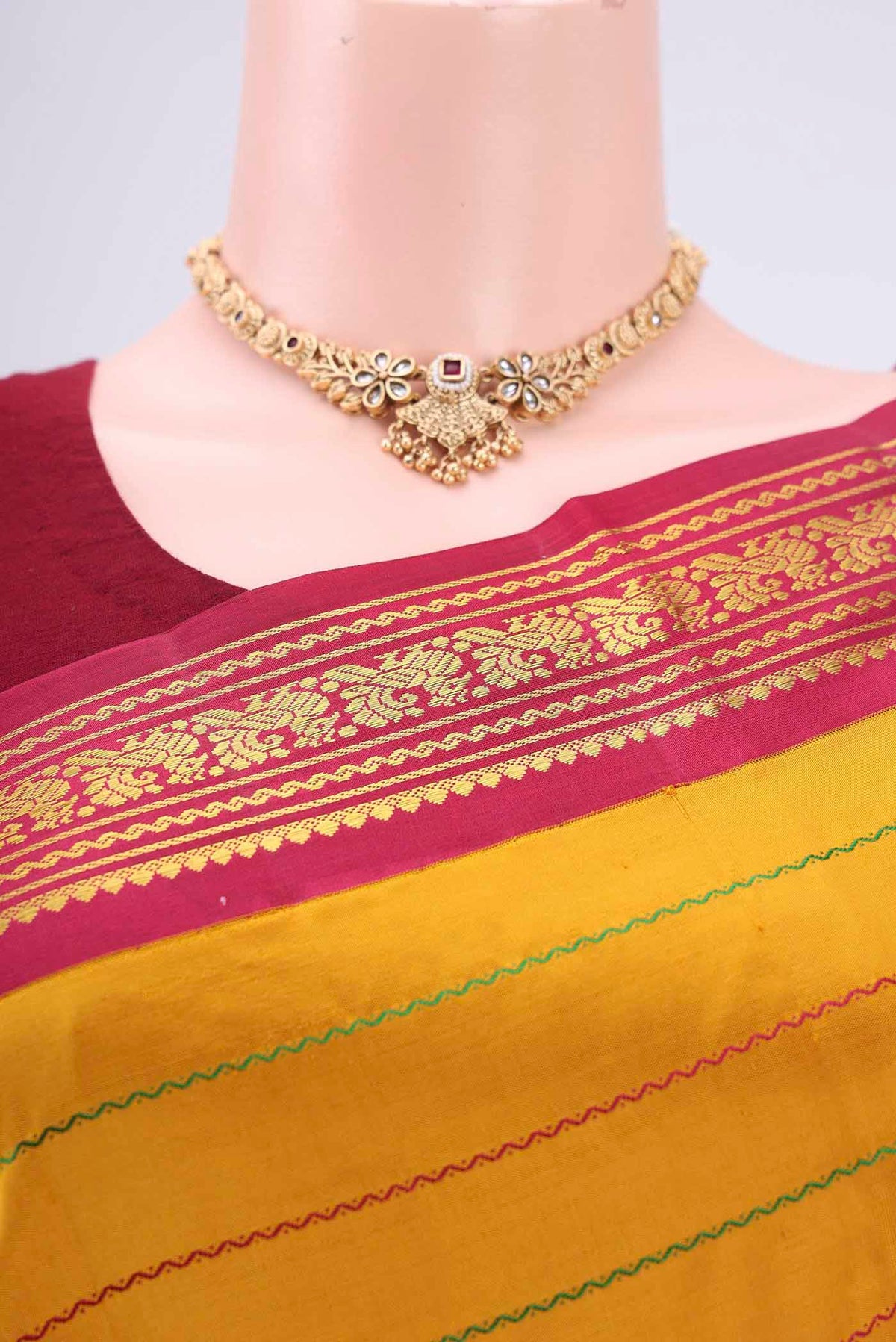 Border image of Mustard Kanchipuram Silk Saree with Veldhari on the body and Zari Border. 