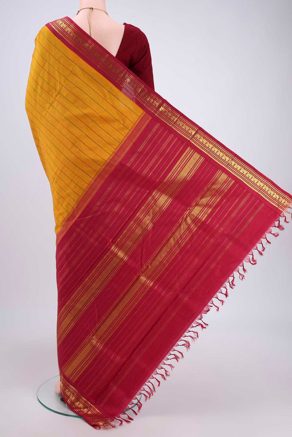 Flat view of Mustard Kanchipuram Silk Saree with Veldhari on the body and Zari Border. 
