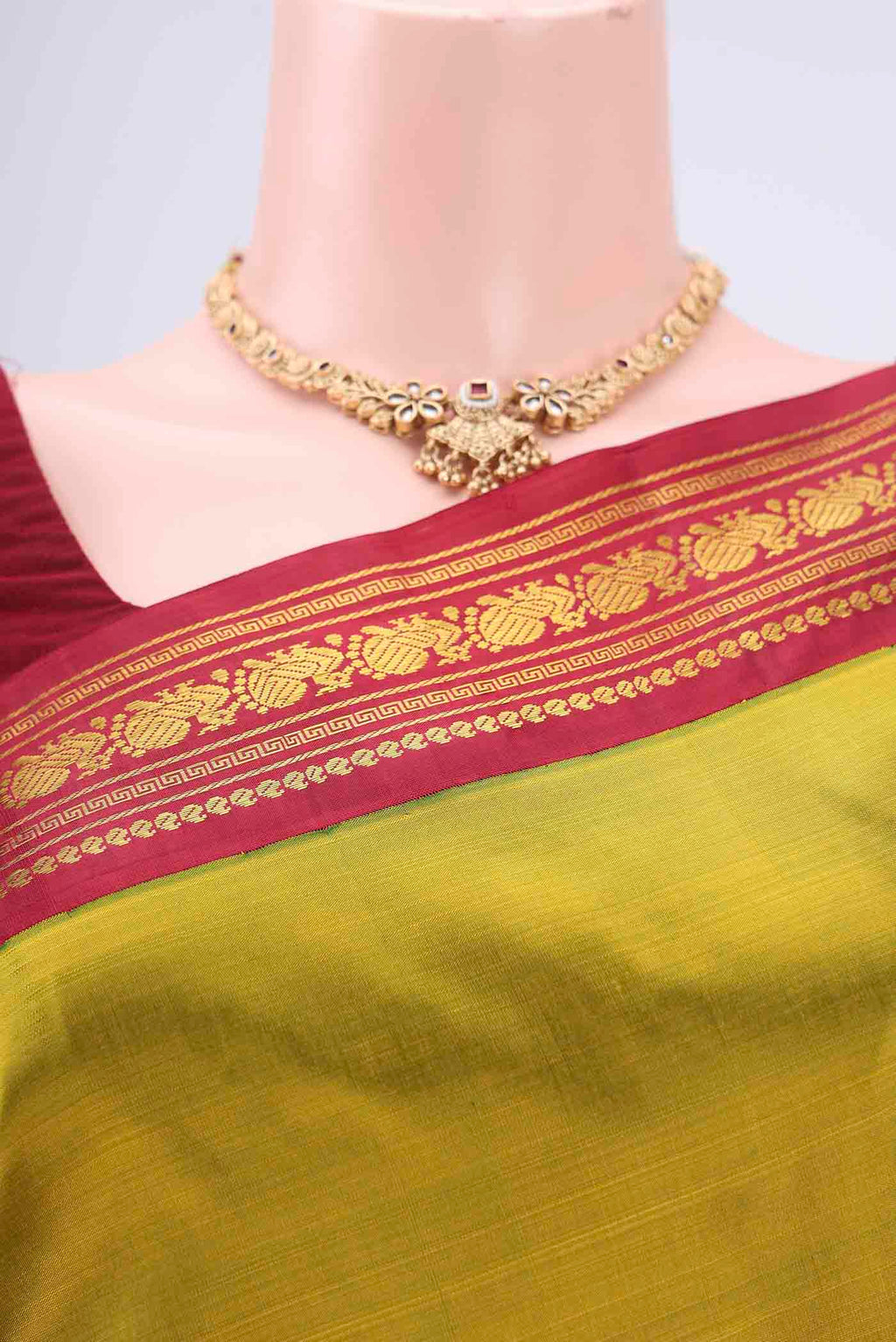 Border image of Mehandi Green Kanchipuram Saree with Plain Body and Zari Border. 