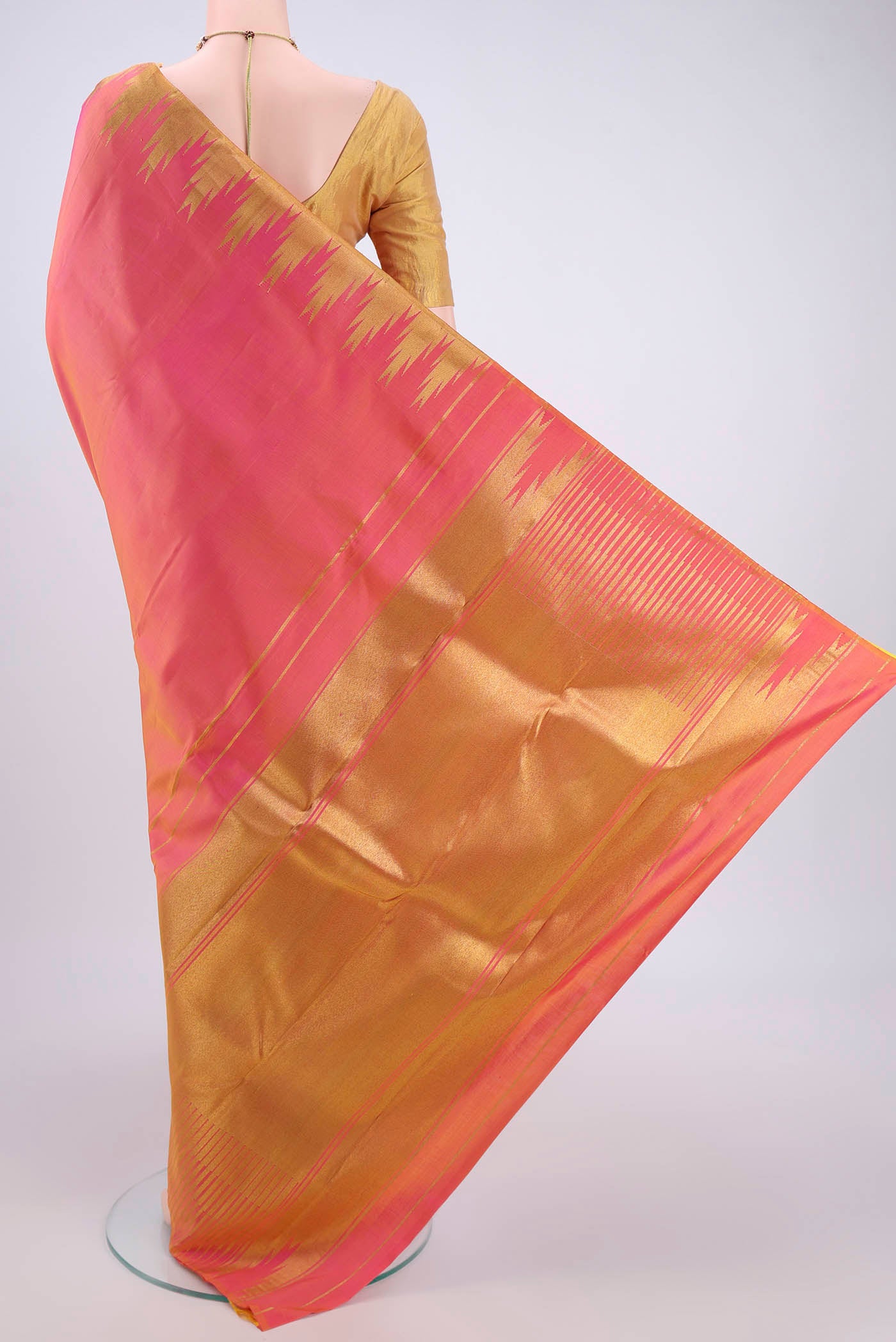 Flat view of Pure Silk Pure Zari Pinkish Yellow Kanchipuram Saree with Zari Butta on the body and Zari Border. 