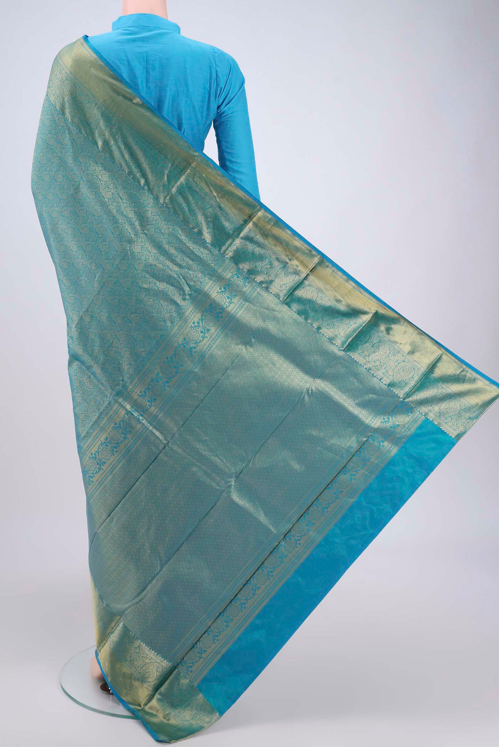 Flat view of Blue Dual Tone Bangalore Silk Saree with Zari Brocade on the body and Zari Border. 