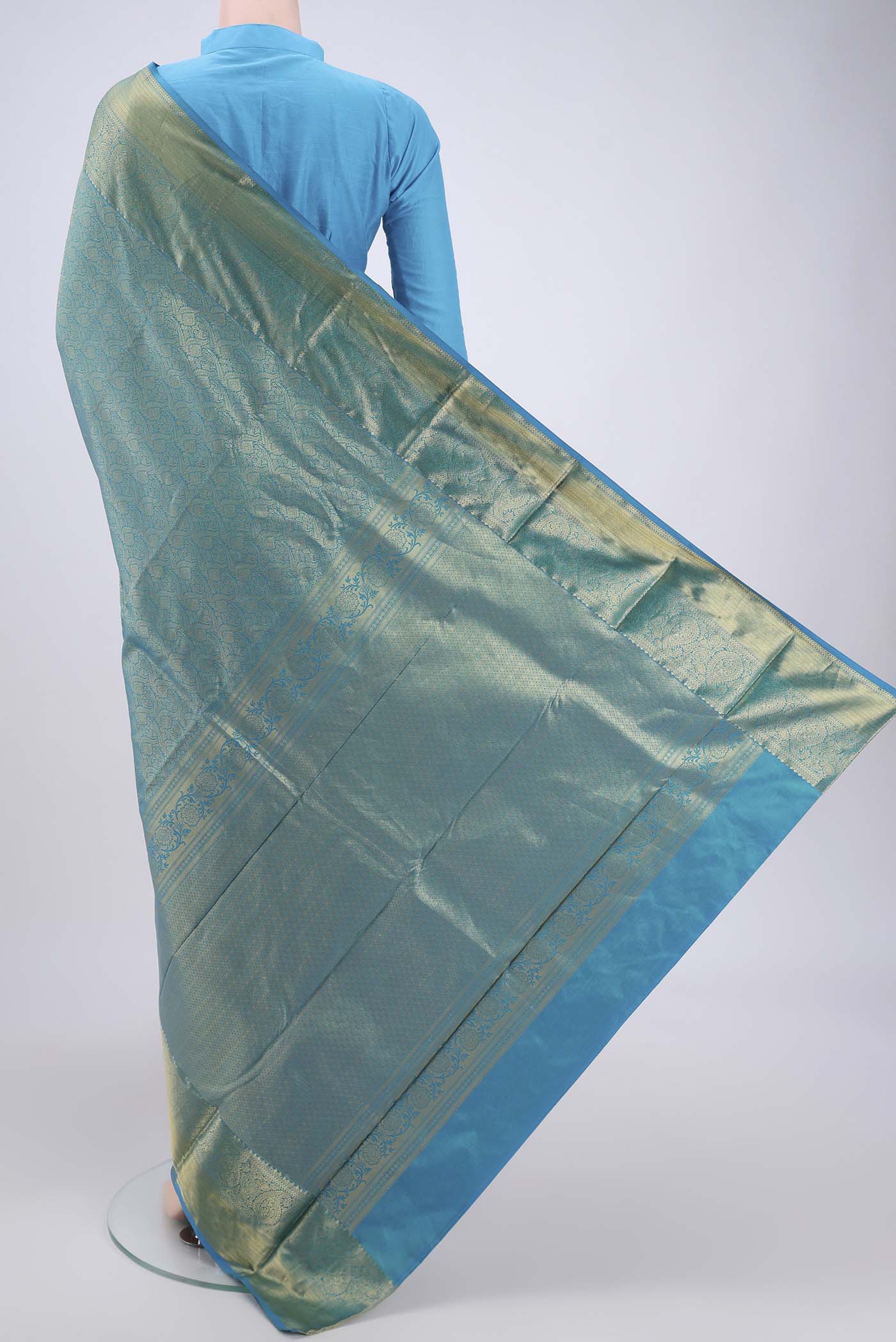 Flat view of Blue Dual Tone Bangalore Silk Saree with Zari Brocade on the body and Zari Border. 