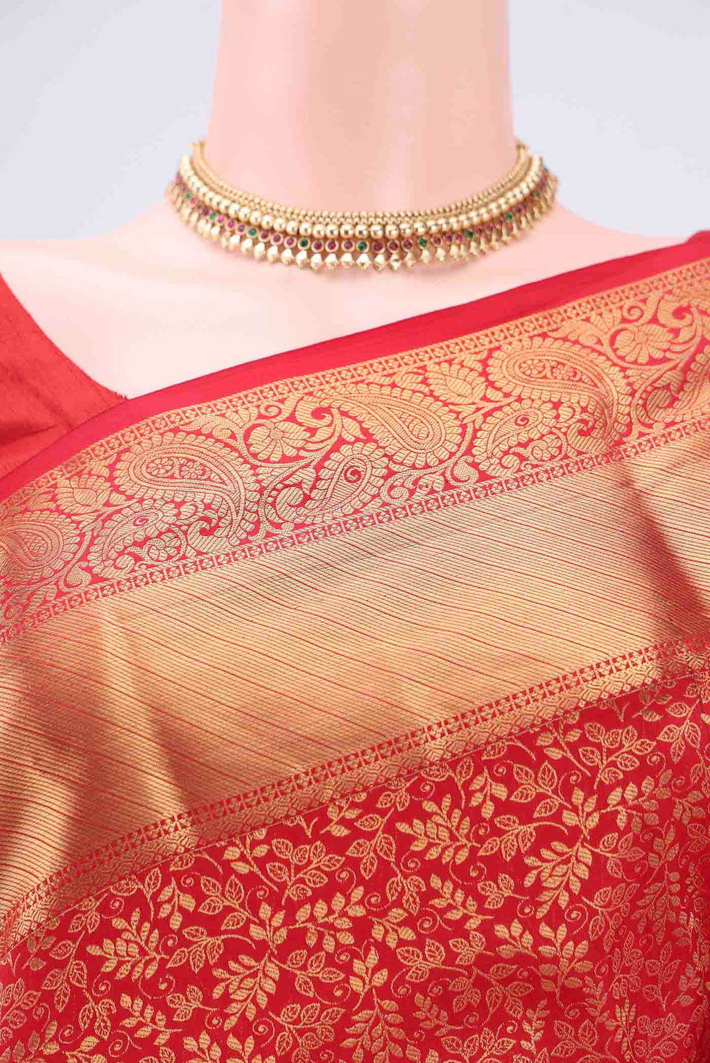Border image of Red Kanjivaram Silk Saree with Zari Butta on the body and Zari Border. 