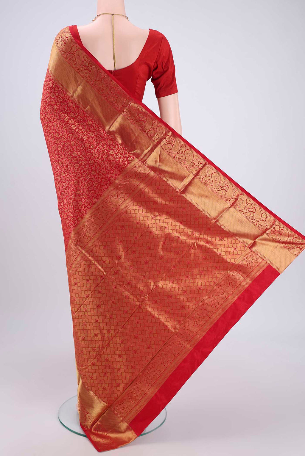 Flat view of Red Kanjivaram Silk Saree with Zari Butta on the body and Zari Border. 
