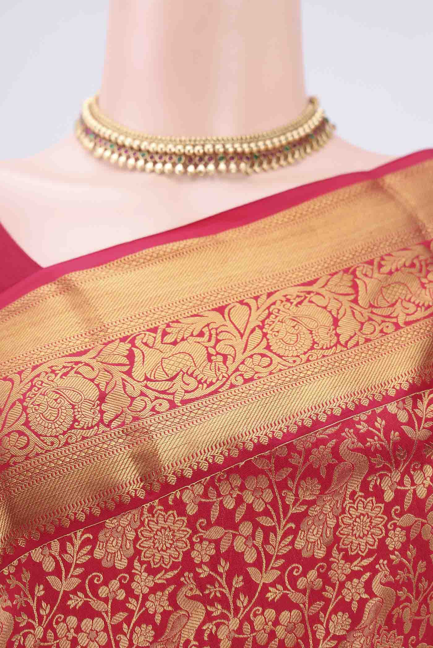Border image of Red Kanjivaram Silk Saree with Zari Butta on the body and Zari Border. 