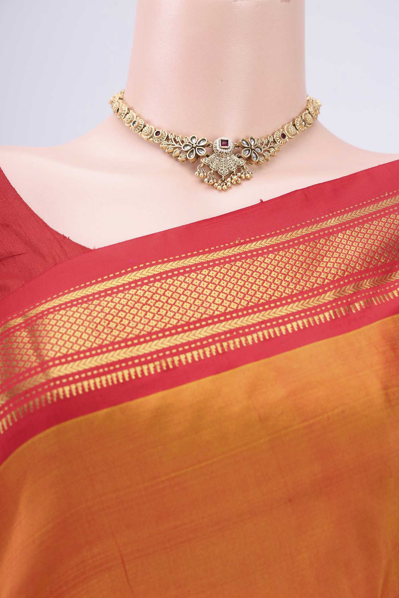 Border image of Orange Paithani Silk Saree with Zari Butta on the body and Zari Border. 