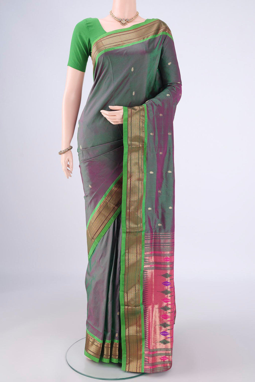 Green Dual Tone Paithani Silk Saree with Zari Butta on the body and Zari Border.  displayed on a mannequin