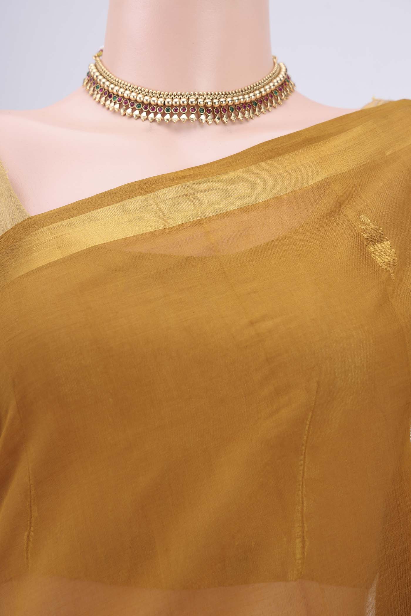 Border image of Mustard Cotton Saree with Zari Butta on the body and Zari Border. 