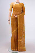 Mustard Cotton Saree with Zari Butta on the body and Zari Border.  displayed on a mannequin