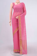 Pink Cotton Saree with Zari Butta on the body and Zari Border.  displayed on a mannequin