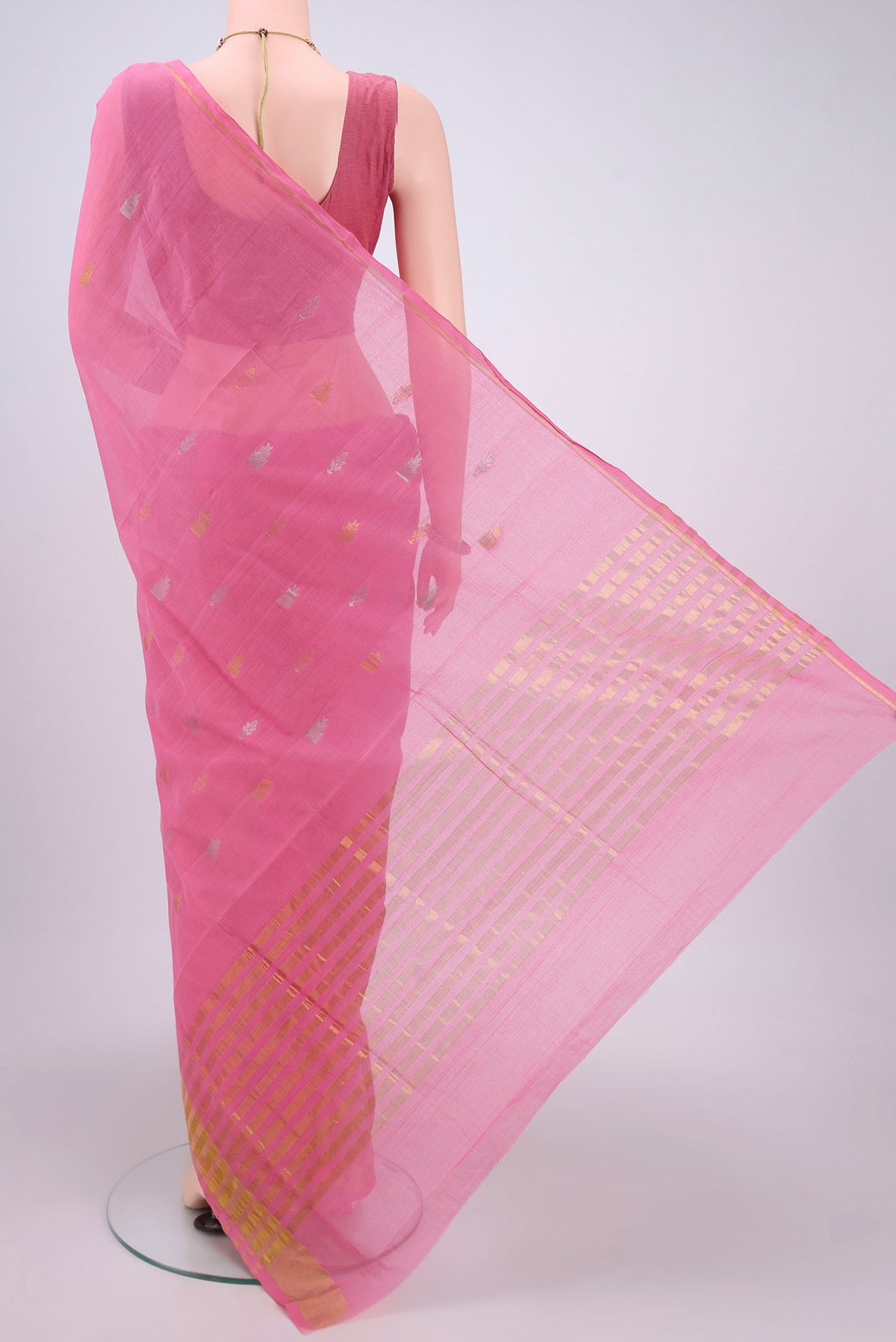 Flat view of Pink Cotton Saree with Zari Butta on the body and Zari Border. 