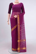 Magenta Cotton Saree with Zari Butta on the body and Zari Border.  displayed on a mannequin