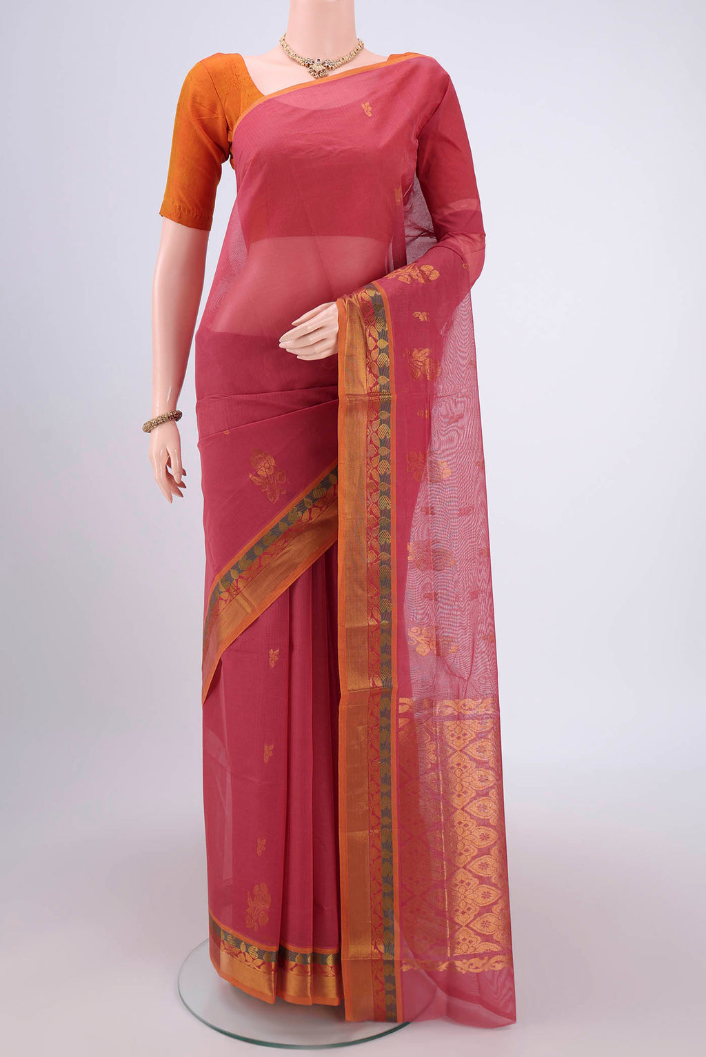 Light Magenta Venkatagiri Cotton Saree with Zari Butta on the body and Zari Border.  displayed on a mannequin