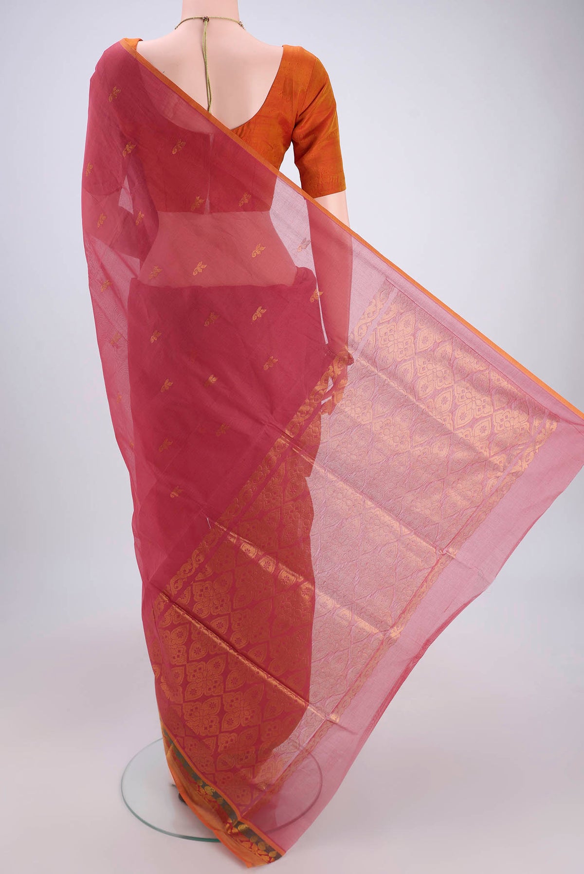 Flat view of Light Magenta Venkatagiri Cotton Saree with Zari Butta on the body and Zari Border. 